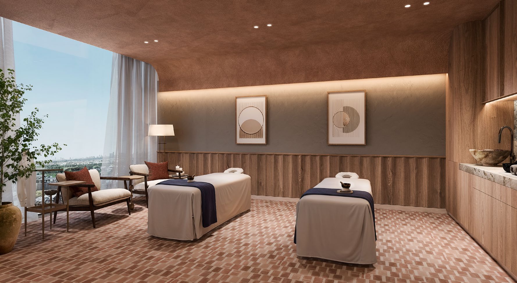 Twin massage treatment room with timber panelling and warm lighting