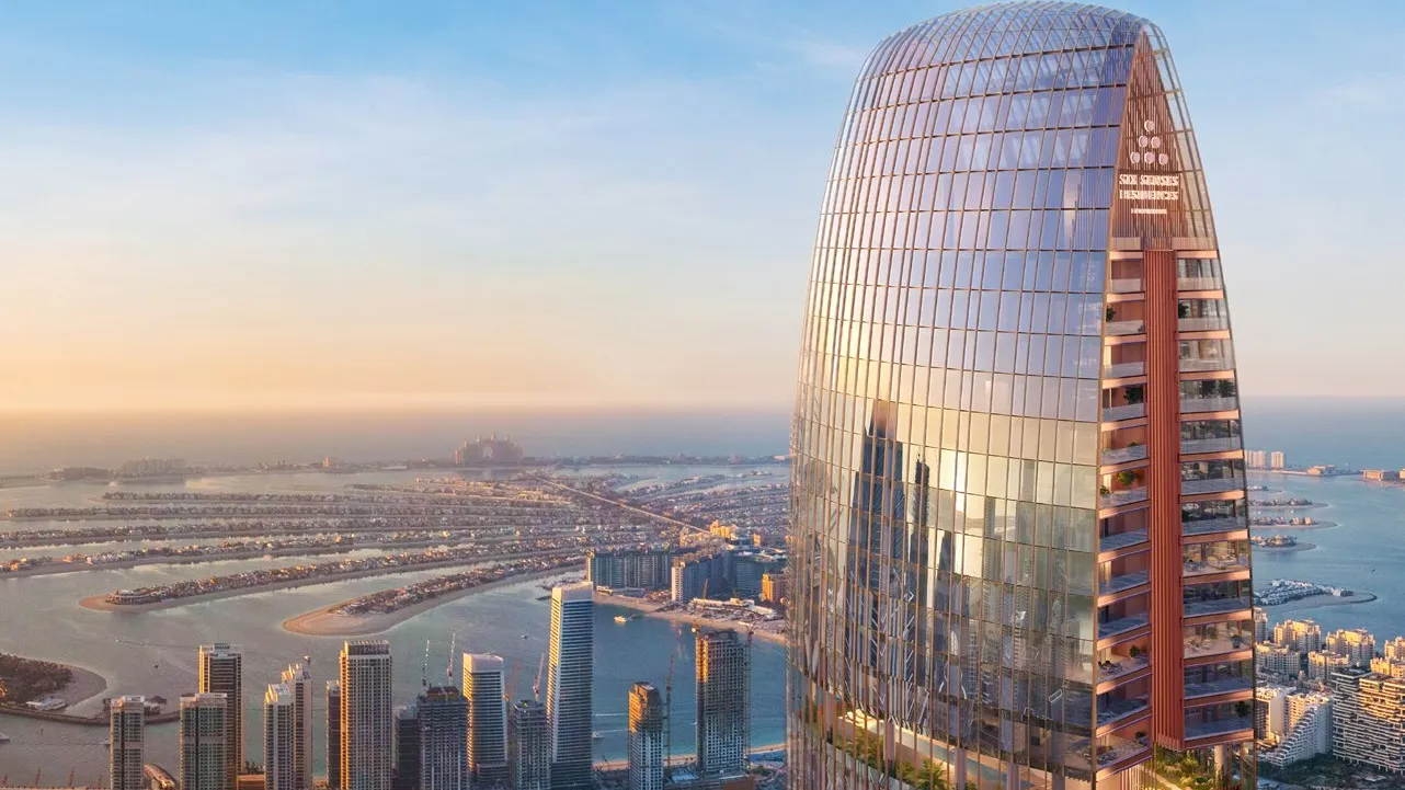 Crown of the tower at sunset above Dubai Marina and Palm Jumeirah